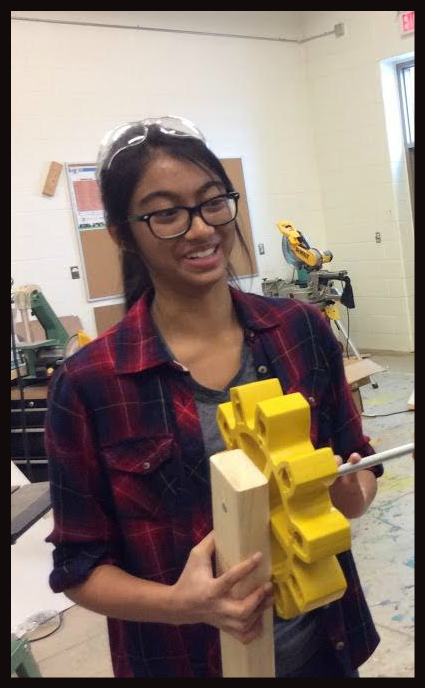 A girl working on a robot