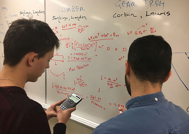 Two students working on math work